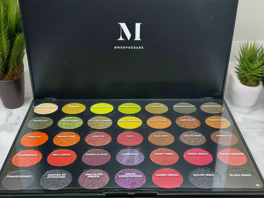 Morphe makeup palette with various colors and 'M' logo on a black background